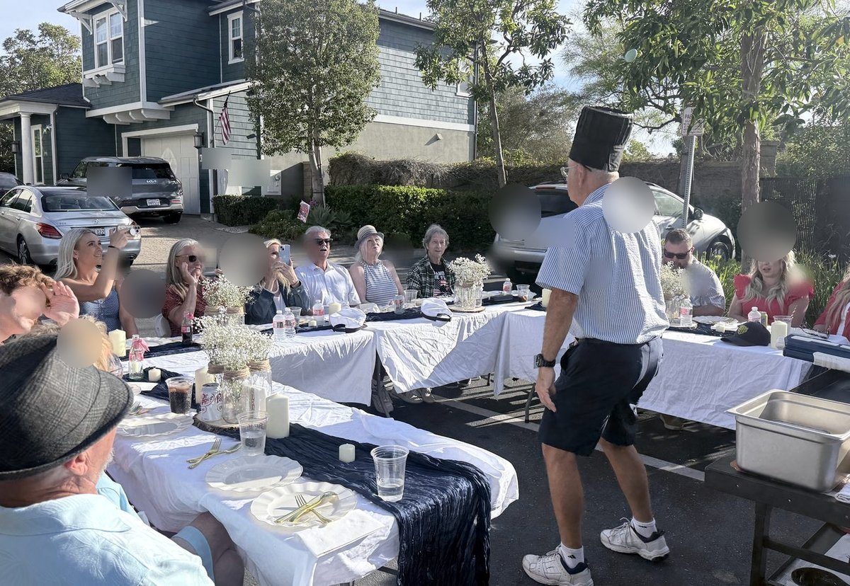 Guests enjoying an interactive moment with their hibachi chef
