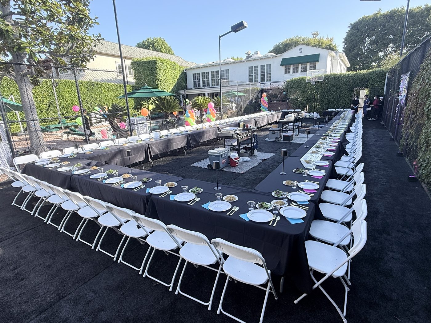 Long backyard hibachi table setup for a private party